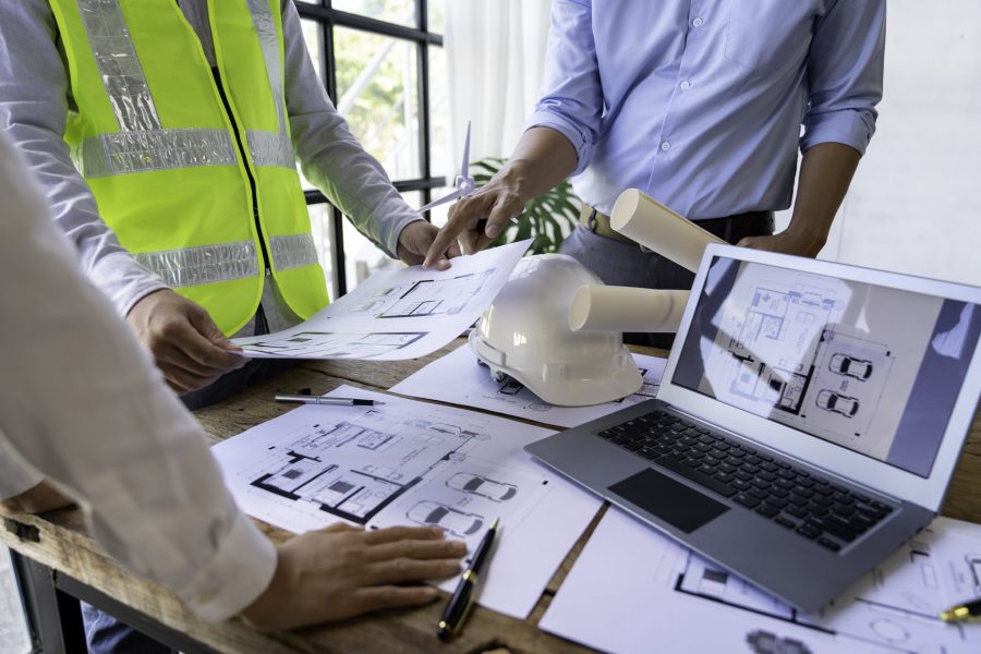 Architecture Engineer Teamwork Meeting, Drawing and working for Architectural projects and engineering tools in the workplace, working ideas on architectural structures.